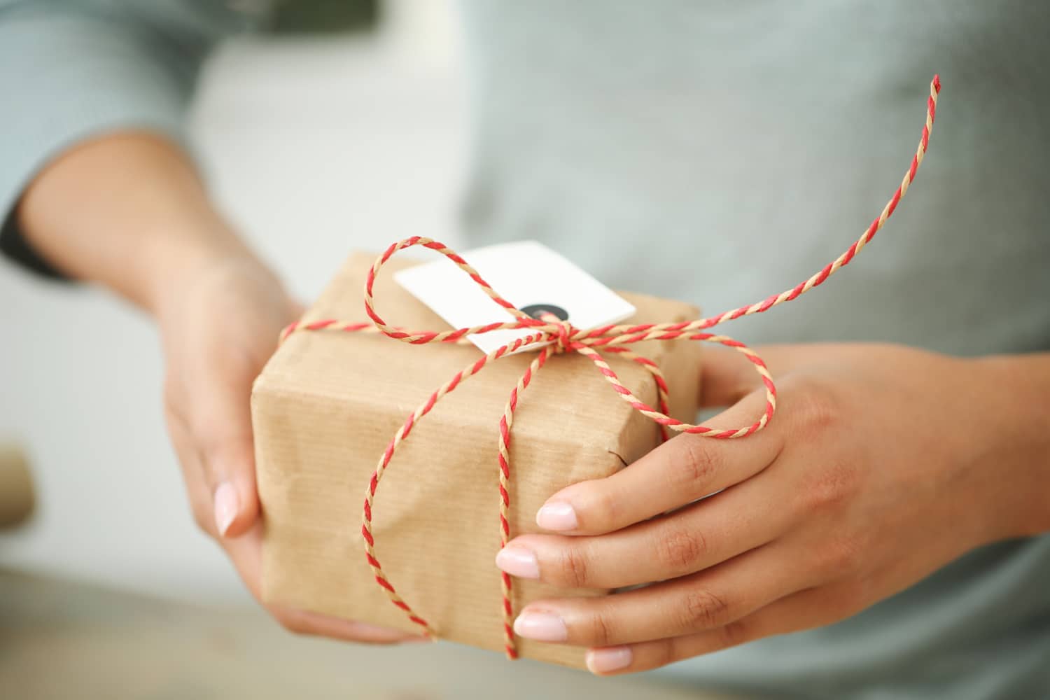 young-woman-wrapping-christmas-present image