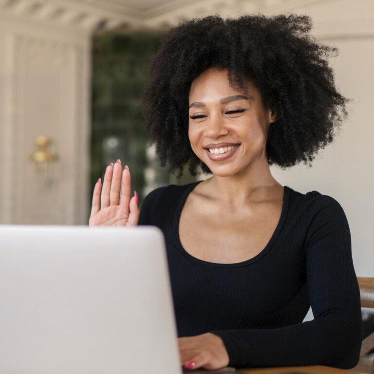 career office young curlyhaired cheerful woman administrator employee uses