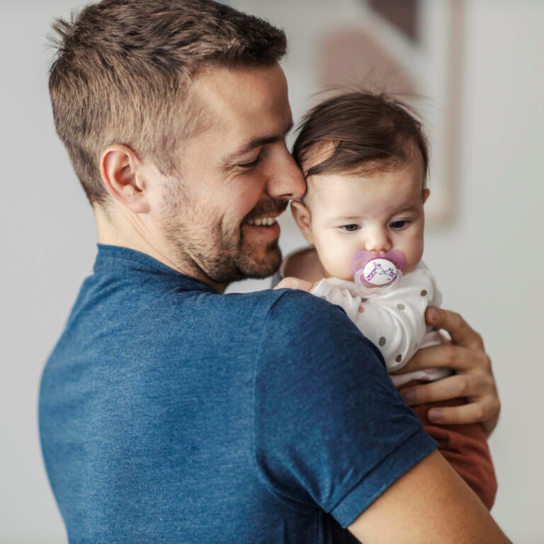 happy father hugging his little daughter e1704739372645