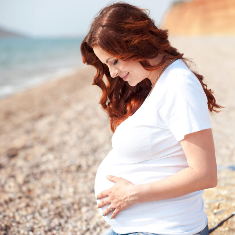 pregnant girl sitting beach resting wearing casual clothes motherhood maternity